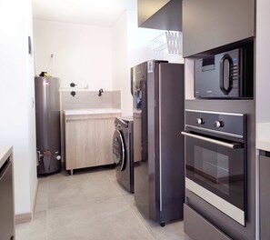 Fridge, microwave, stovetop, coffee/tea maker