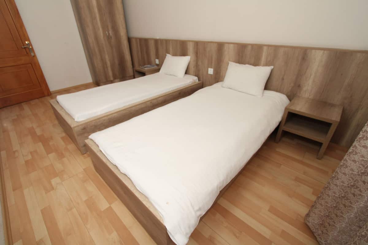 Standaard Twin kamer | 2 slaapkamers, luxe beddengoed, een minibar, een kluis op de kamer