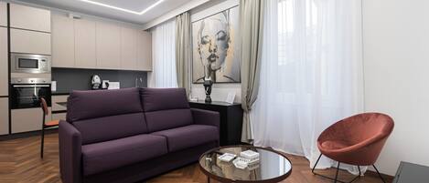 Apartment (1 Bedroom) | Living area | 34-inch TV with cable channels