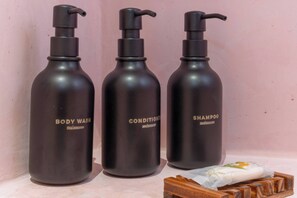 Shower, hair dryer, towels, shampoo