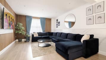 Luxury Duplex, 4 Bedrooms, Air conditioning | Living room | 70-inch LED TV with digital channels, Netflix, Hulu