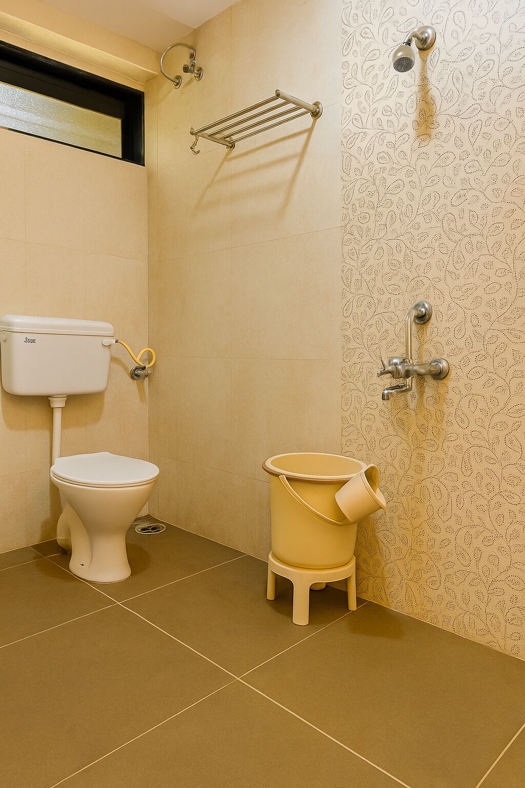 A bathroom with a toilet, a bidet, and a shower area.