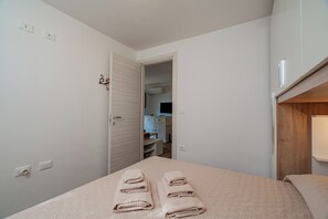 Apartment, 2 Bedrooms | 2 bedrooms, premium bedding, blackout curtains, iron/ironing board - Casa Donatella (Orosei)