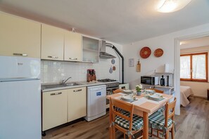 Apartment, 2 Bedrooms | Private kitchen | High chair, paper towels - Casa Donatella (Orosei)