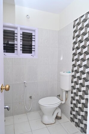 Shower, hair dryer, slippers, towels