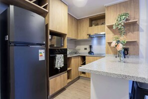 Microwave, oven, coffee/tea maker, cookware/dishes/utensils