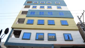 Stylish building with balconies and windows, offering a unique urban perspective.