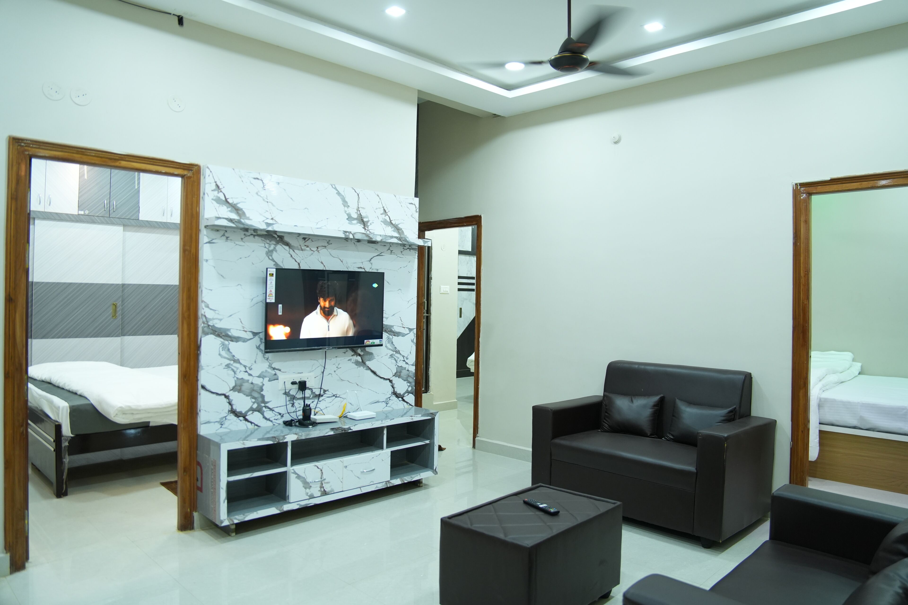 Family Studio, Balcony, City View | Living area | Flat-screen TV