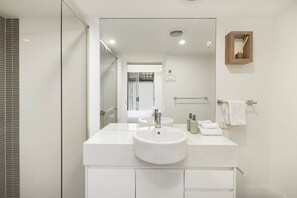 Shower, hair dryer, towels, shampoo