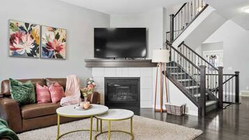 TV, fireplace, books, offices