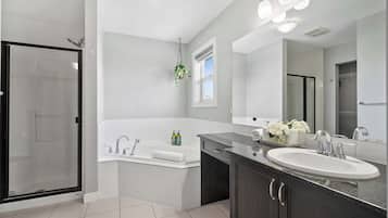 Shower, hair dryer, towels, shampoo