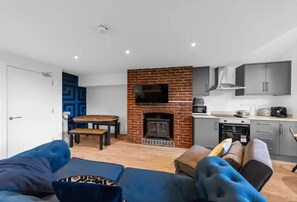 Cabin | Living area | Fireplace - Canterbury Castle Lodge - 8 Bedroom Retreat (Canterbury)