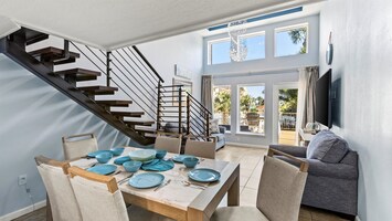 Kitchen conveniently next to dining table.