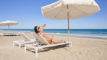 On the beach, sun loungers