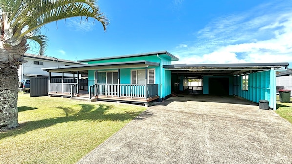 A two-story house with a covered porch and a garage. - Sunshine on Heath -Pet Friendly (Evans Head)