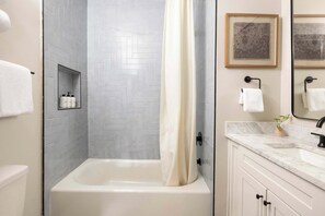 Shower, hair dryer, towels, shampoo
