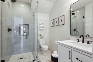 Shower, hair dryer, towels, shampoo