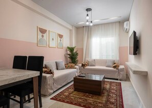 TV - Boho 2BR Apt with Private Garden by Travelholic (90st , New Cairo)