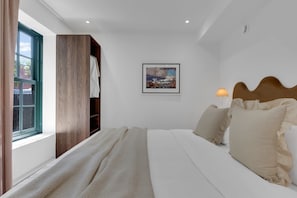 1 bedroom, desk, iron/ironing board, travel cot