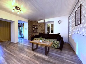 Apartment, Patio, Garden View | Living area | 32-inch flat-screen TV with cable channels