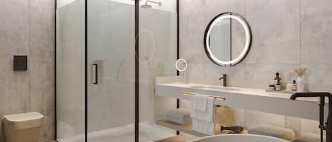 A modern bathroom with a glass-enclosed shower, a freestanding bathtub, and a vanity with a mirror.