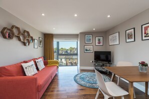 Luxury Apartment, City View | Living area | 43-inch LED TV with digital channels
