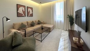 Deluxe Apartment | Living area | Flat-screen TV - M-Residence by Dayf Self-Service Apart. (Jeddah)