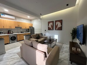 Family Apartment | Living area | Flat-screen TV - M-Residence by Dayf Self-Service Apart. (Jeddah)