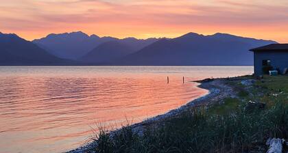 Large waterfront beach house with hot tub, game room, & private beach access