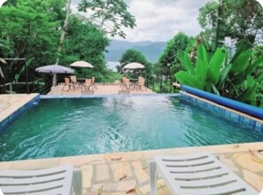Outdoor pool, pool umbrellas, pool loungers