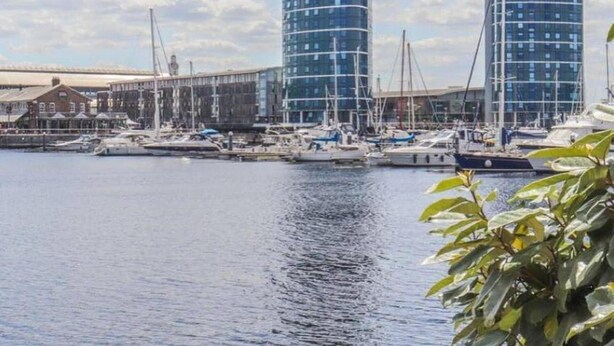 A marina with modern buildings and boats. - 4 Guests - Marina Point East Escape in Kent (Chatham)