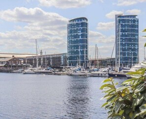 A marina with modern buildings and boats. - 4 Guests - Marina Point East Escape in Kent (Chatham)