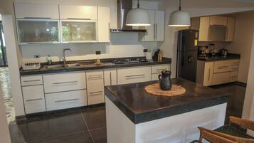 Fridge, microwave, stovetop, coffee/tea maker