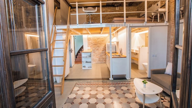 A compact, modern apartment with a loft-style sleeping area, a kitchen, and a bathroom. - Barcelona Classic Ramblas - Plaza Real (Barcelona)
