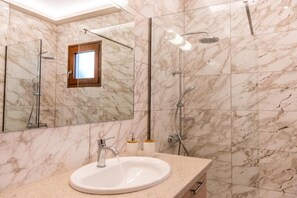 Shower, hair dryer, towels, soap