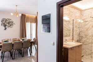 Shower, hair dryer, towels, soap