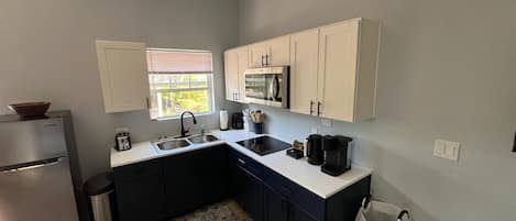 Fridge, microwave, stovetop, coffee/tea maker