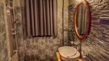 Shower, hair dryer, towels, toilet paper