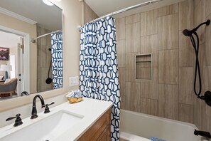 Shower, hair dryer, towels, toilet paper