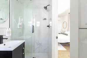 Shower, hair dryer, towels, soap