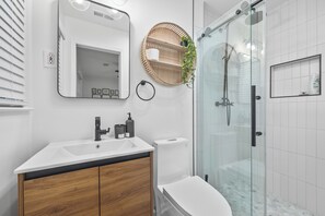 Shower, towels, soap, toilet paper