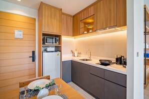 Fridge, microwave, toaster, cookware/dishes/utensils