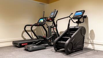 A fitness area with treadmills and a stair climber.