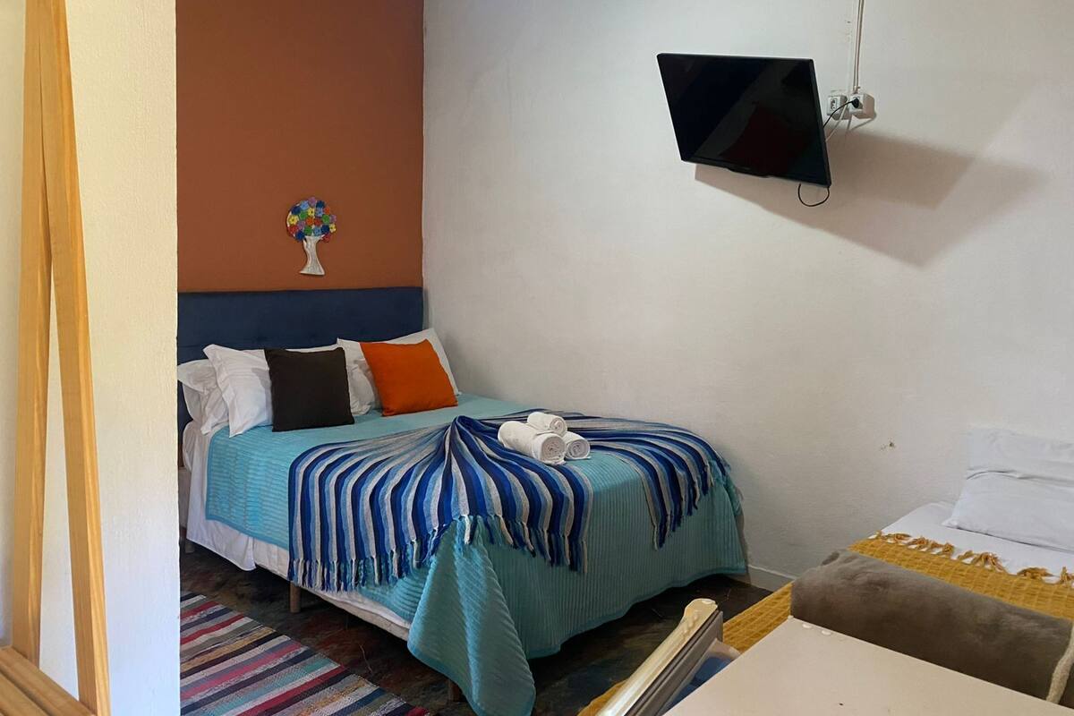 Standard Triple Room, Pool View | Desk, laptop workspace, free WiFi