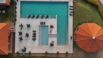 Outdoor pool, open 9:00 AM to 6:00 PM, pool umbrellas, pool loungers