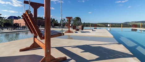 Outdoor pool, open 9:00 AM to 6:00 PM, pool umbrellas, pool loungers