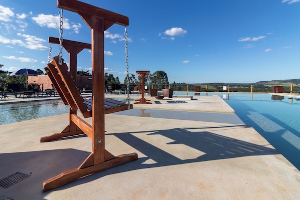 Outdoor pool, open 9:00 AM to 6:00 PM, pool umbrellas, sun loungers