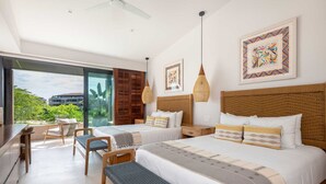 A modern hotel room with two beds, a desk, and a balcony with a view of the city.
