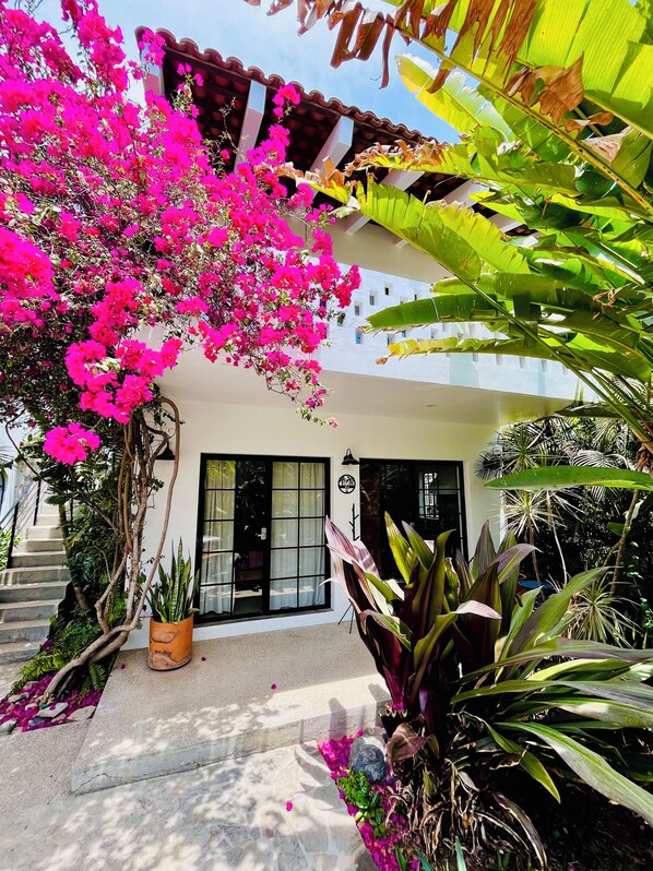 A house with a white exterior, a tiled roof, and a front entrance with glass doors. - Kitchen, Saltwater Pool, Fast Wifi, Queen Bed, Air Conditioning - "Mar" (San Francisco)