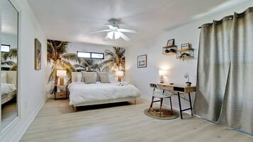 3 habitaciones, escritorio y tabla de planchar con plancha